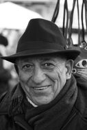 black and white portrait of mature man in a hat