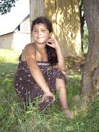 little gypsy in the shade of a tree