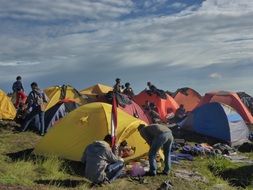 people at colorful tents in Camping, Hiking