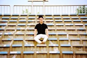 asian boy in empty stadium