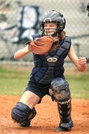 softball player in glove on the field