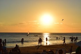 People on a beach at evening