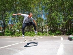 guy doing skate tricks in a skate park