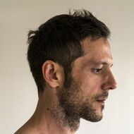 the man's head is photographed in profile
