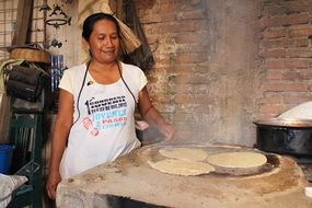 mexican woman cooking traditional food