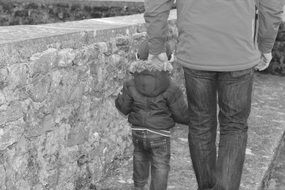 Black And White picture of the baby and father