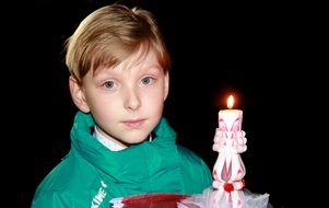 portrait of a boy with a candle