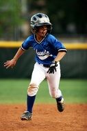 man runs across the field in baseball