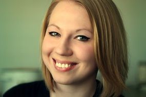 portrait of a smiling girl with green eyes