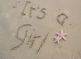 It's a girl text on a sand
