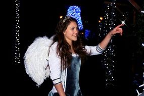 girl like an angel among christmas lights