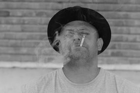 portrait of a man with a smoking cigarette