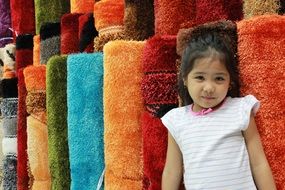 child in a carpet shop
