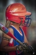 girl playing softball