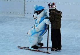 child Ice skating with driving help