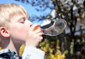 baby blowing bubbles