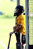 goalkeeper in helmet, field hockey