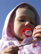 cute girl with pacifier