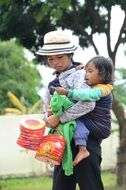 Mom with a child at a Vietnamese street festival