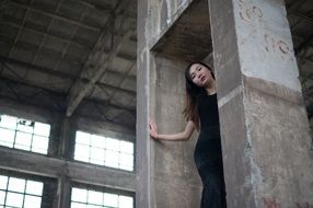 asian model between concrete columns