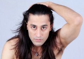 portrait of indian man with long hair