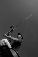 Black and white photo with the fisherman