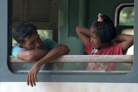 daughter and father on the train in Asia