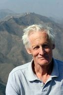 elderly man on the background of the mountain