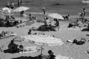 Black and white photo of the Mediterranean beach with the people