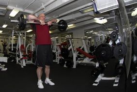 man with barbell in the gym