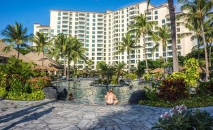 pool in front of a building in a hawaii resort