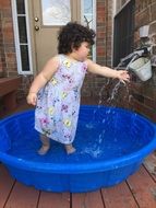 Child in a small swimming pool