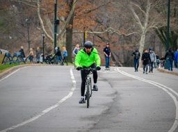 cyclist in a green jacket