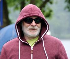 senior bearded Man in hoodie