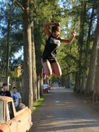 sportswoman in a jump in the park