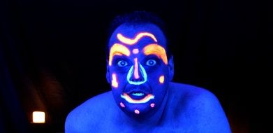 man's face neon pattern on his face