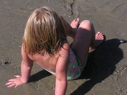 little blonde girl on the beach