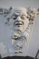 stone carving, manâs Face on Wall