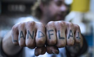 tattoo on fingers close-up landflai