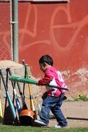 little athlete with a bat
