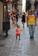 father with a child on a city street in Barcelona