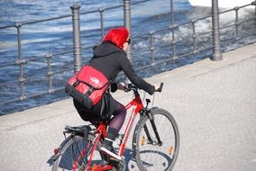 Person on the bicycle on the street on a sunny day