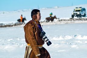 Photographer, asian man with camera at Winter landscape