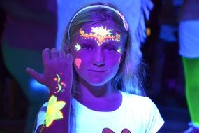 girl with luminescent face art