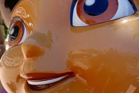 big plastic face of a toy close-up