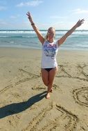 happy girl on a sunny beach in los angeles