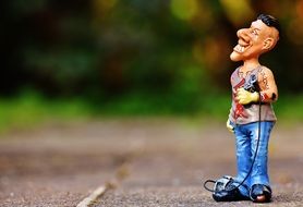 Artist, plastic Figure of Funny Man with Tattoo outdoor