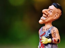 closeup picture of funny tattoo artist as a comic figure