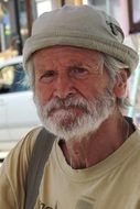 photo of an old man in panama in Greece