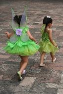 two little girls like green fairies